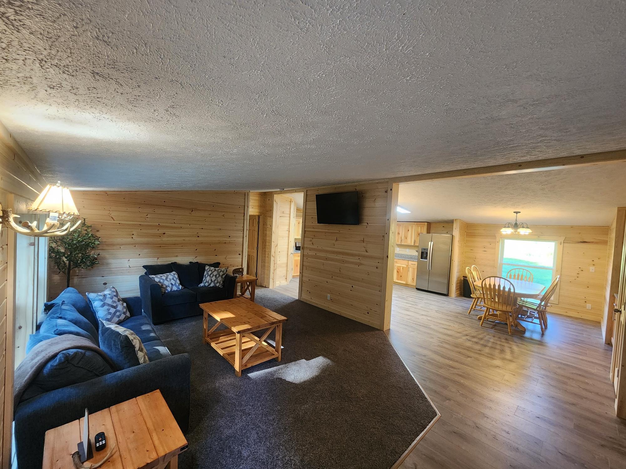 Open Living Area with 55" Smart TV & Kitchen View